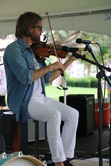 Dan Stacey of Dan Stacey and the Black Swans performs at the north concert stage Saturday at the Home County Music and Art Festival. (SHANNON COULTER, The London Free Press)