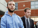 Triple murderer Jesse Imeson is escorted by a local police officer after his arrest following a high-profile nationwide hunt in 2007. (Free Press files)