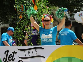 A woman on the City of London float who did not want to be identified cheers at the Pride London Festival parade. (SHALU MEHTA, The London Free Press)