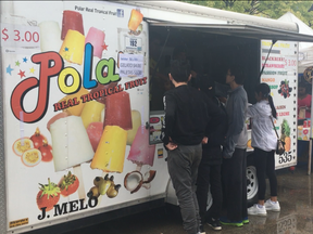 Festival-goers line up for gelato and paletas at a dessert stand for the Colombian Day Festival on Sunday. Located at the Covent Garden Market, The festival celebrates Colombia’s Independence Day, which was last Friday. (SHANNON COULTER, The London Free Press)