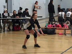 Katlynn Derouard, 15, prepares for the next serve at a high school volleyball tournament at Dryden secondary school in Dryden, Ontario. Derouard is one of the athletes travelling the farthest to compete at the Ontario Summer Games next month. (Submitted)