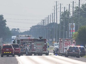 Emergency vehicles gather on County Road 42 east of Elmstead Road in Lakeshore where two vehicles collided on the evening of July 15, 2018.