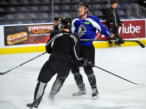 London Knights forward Alex Formenton, left, and defence man Evan Bouchard during practice at Budweiser Gardens. (File photo)
