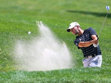 Thomas Simpson of the Beacon Hall Golf Club in Aurora blasts out of a bunker on the eighth hole of the St. Thomas Golf and Country Club in Union on the first day of the Ontario Men's Amateur on Tuesday. (Mike Hensen/The London Free Press)