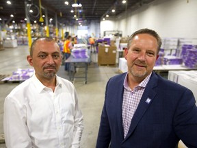 Hasan Habash, the director of Operations and Scott Louch, the C.O.O. for Goodwill Ontario Great Lakes in their huge White Oak Road location in London. (Mike Hensen/The London Free Press)
