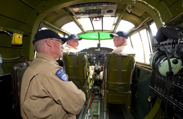 Post flight debrief, crew chief Roland Smith talks with Pilot Richard Petty and pilot and Operations officer Travis Major after a short flight by a WWII Mitchell B-25 bomber over Sarnia as part of a tour by the Commemorative Air Force on Thursday July 12, 2018. The B-25 was made famous by the Doolittle Raid, early in WWII after the U.S. was hit by the Japanese at Pearl Harbour, 16 B-25's launched off an aircraft carrier and bombed Tokyo and then ditched their planes in China. Mike Hensen/The London Free Press/Postmedia Network