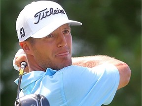 Garrett Rank watch his shot on the 18th hole at the St. Thomas Golf and Country Club in Union. Rank won the Ontario Men's Aateur on Friday. (Mike Hensen/The London Free Press)