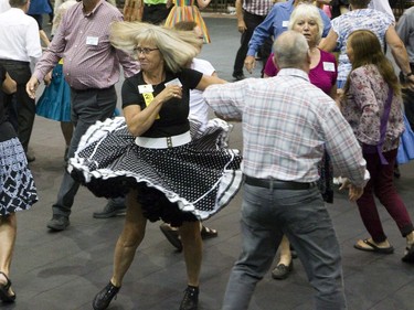 Nancy Van Uden of Belleville dances with Murray Pattenden of Newcastle in a "trail in dance" during the 20th Canadian National Square and Round Dancing Convention in London, Ont. on Wednesday July 18, 2018. Derek Ruttan/The London Free Press/Postmedia Network