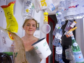 Jordan Hawkswell stands amid the beginnings of an art installation in the old Novacks store on King Street that will try to illustrate the amount of plastic in our oceans. Mike Hensen/The London Free Press