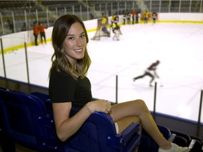 Exeter native Cayley Mercer, 24, watches a practice at Western Fair Sports Centre Wednesday in London. Mercer started her hockey career with the London Devilettes and played professional hockey in China this season for the Vanke Rays, an expansion team in the Canadian Women's Hockey League.  (Derek Ruttan/The London Free Press)