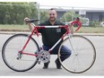 Gus Kailis, ambassador for the MS Bike Grand Bend To London fundraising ride, shows off The Bike With Multiple Sclerosis in London on Thursday. The bike is modified to give riders a sense of what it's like to live with MS. (Derek Ruttan/The London Free Press)