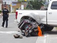 A motorcyclist was taken to hospital with serious injuries after colliding with a pickup near Hamilton Road and Tennyson Street in London Thursday, police said. (DEREK RUTTAN, The London Free Press)