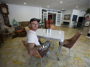 William Older, owner of Lilley's Corner, a heritage property at Adelaide and Dundas streets, relaxes July 27  in Baker's Dozen, an arts incubator in a section of the building that once housed Chapman's Bakery. 
(Derek Ruttan/The London Free Press)
