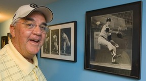Mike Kilkenny, a longtime major league pitcher and golf pro in his basement with a few of the images of his life in the major leagues. (MIKE HENSEN, The London Free Press file photo)