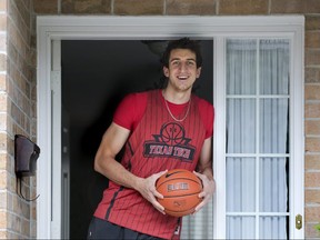 Dejan Kravic stands in the doorway of his parents home in London, Ontario. He is a former Texas Tech centre. (File photo)