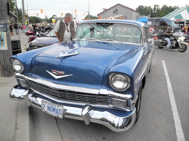 A number of classic vehicles mixed with motorcycles in downtown Port Dover Thursday on the eve of this week’s big Friday the 13th motorcycle rally. Among those admiring this 1956 Chevy Nomad station wagon on Walker Street was Bill Ferguson of Jarvis. (MONTE SONNENBERG \ SIMCOE REFORMER)