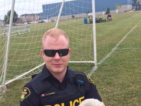 Provincial Constable Ron Klassen with the snowy owl.