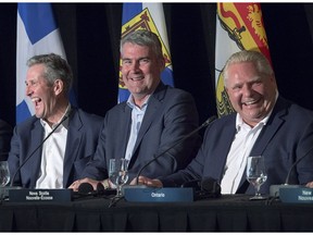 PRIMACY TO THE PREMIERS? Manitoba Premier Brian Pallister, Nova Scotia Premier Stephen McNeil and Ontario Premier Doug Ford at the closing news conference of the Canadian premiers meeting in St. Andrews, N.B. July 20.