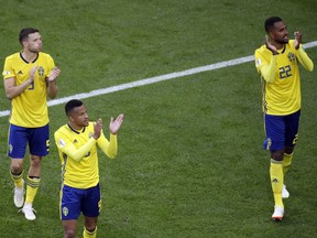 Sweden teammates celebrate after winning the round of 16 match between Switzerland and Sweden at the 2018 soccer World Cup in the St. Petersburg Stadium, in St. Petersburg, Russia, Tuesday, July 3, 2018. (AP Photo/Dmitri Lovetsky) ORG XMIT: XDMV177