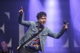 Max Kerman of the Arkells gestures on stage as the Hamilton-based rockers close out Bluewater Borderfest Saturday. Organizers estimated about 7,500 people attended the three-day music festival. (Metcalfe Photography)
