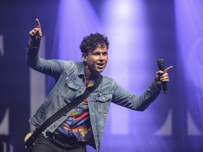 Max Kerman of the Arkells gestures on stage as the Hamilton-based rockers close out Bluewater Borderfest Saturday. Organizers estimated about 7,500 people attended the three-day music festival. (Metcalfe Photography)