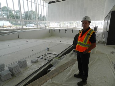 Jeff Wilson of the City of London stands by the nearly completed main pool in the YMCA wing of the centre. (HANK DANISZEWSKI, The London Free Press)