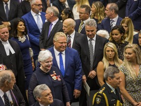 Ontario Premier Doug Ford and Lt.-Gov. of Ontario Elizabeth Dowdeswell, enter the legislative chamber for the throne speech at Queen's Park in Toronto on Thursday. (Ernest Doroszuk/Postmedia News)