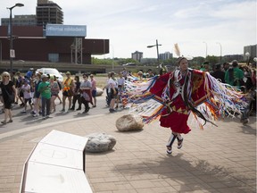 A traditional dancer performs at the Rock Your Roots Walk for Reconciliation during the National Indigenous Peoples Day event at Victoria Park in Saskatoon, June 21, 2018.