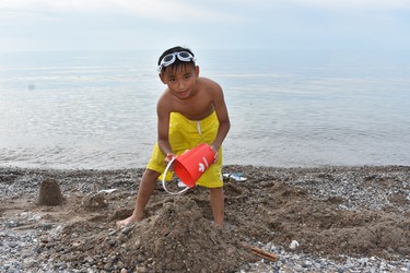 Lionel Pham of Mississauga is busy building a sandcastle on the beach at Pinery Provincial Park, enjoying the getaway with his family.

BARBARA TAYLOR/THE LONDON FREE PRESS