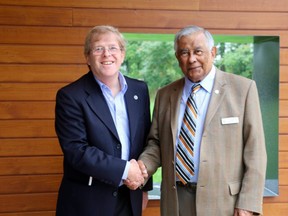 L'Arche London campaign chair, Garry Dodman (left) shakes hands with the Westminster College Foundation president, Roderick Singh. Singh's foundation donated $15,000 to the L'Arche Gathering Place campaign. The donation will be matched by Arthur and Sonia Labatt for a total donation of $30,000. (SHANNON COULTER, The London Free Press)