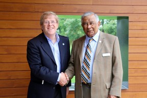 L'Arche London campaign chair, Garry Dodman (left) shakes hands with the Westminster College Foundation president, Roderick Singh. Singh's foundation donated $15,000 to the L'Arche Gathering Place campaign. The donation will be matched by Arthur and Sonia Labatt for a total donation of $30,000. (SHANNON COULTER, The London Free Press)