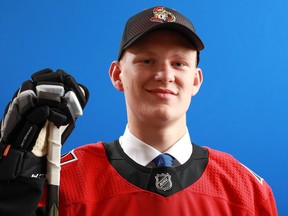 Brady Tkachuk poses after being selected fourth overall by the Ottawa Senators during the first round of the 2018 NHL Draft at American Airlines Center on June 22, 2018 in Dallas, Texas.