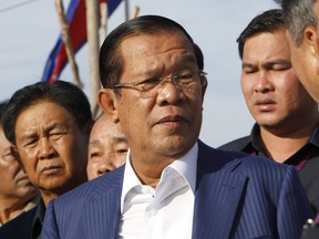 Cambodian Prime Minister Hun Sen arrives for an event in Phnom Penh, Cambodia, Wednesday, Aug. 1, 2018. Determined to extend his 33 years as Cambodia's strongman ruler Hun Sen was not about to let an election derail what he believes is his destiny. The 65-year-old leader had declared he intends to stay in office for 10 more years, and Sunday's general election victory by his Cambodian People's Party should get him halfway to that goal. (Heng Sinith/AP Photo)