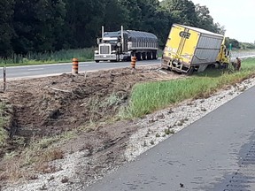 Handout/Chatham Daily News Chatham-Kent OPP say a high-tension cable barrier prevented this transport truck from crossing the median into oncoming traffic on Highway 401 near Kenesserie Road in east Chatham-Kent, Ont. on Saturday, August 18, 2018.