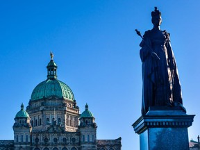 A statue of Queen Victoria sits on the ground of the British Columbia legislative building in Victoria, B.C. Should it -- and the name of the city -- be the next to go, a reader asks. (Getty Images)