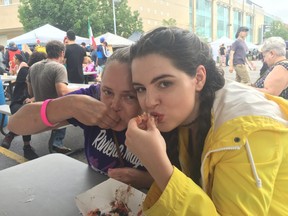 Carel (left) and Megan Whelan enjoy some tacos at London Taco Fest on Saturday. SHALU MEHTA/THE LONDON FREE PRESS