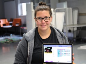 Kelsey Lavigne is the organizer for the Girls Recognizing Engineering and Technology Retreat at Western University this weekend. It is aimed at introducing young girls to science and engineering. Lavigne is showcasing a coding exercise that girls will perform at the program to make mini scavenger hunts using programmable robot compasses. SHALU MEHTA/THE LONDON FREE PRESS