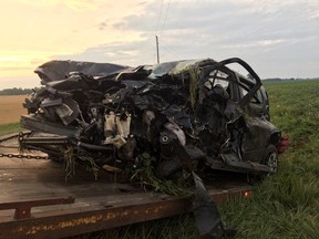 Two people were injured when a car and a garbage truck collided south of London Wednesday. This photo depicts the mangled car. (OPP supplied photo)