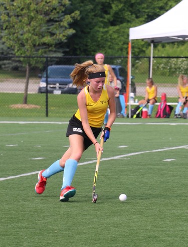 Meagan Hobson of Waterloo drives up the field during a game of field hockey on Friday. Her team, Ontario West, went on to win gold at the Ontario Summer Games. (SHANNON COULTER, The London Free Press)