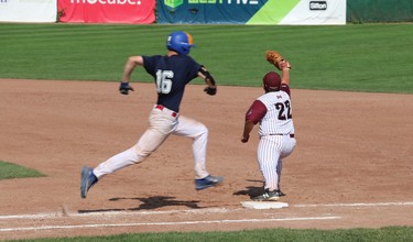 Eastern Ontario Baseball Association's Tyler Robichaud tries to outrun the throw to London Badger's Trent Sillet at first base during the gold medal match on Sunday. (SHANNON COULTER, The London Free Press)