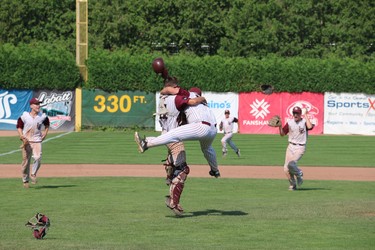 Ben Granger (left) jumps in the air with Trent Sillet to celebrate their gold medal victory on Sunday at Labatt Park. (SHANNON COULTER, The London Free Press)