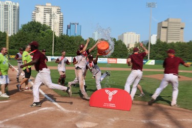 Players from the London Badgers attempt to pour water over their coaches after their gold medal victory at the Ontario Summer Games on Sunday. (SHANNON COULTER, The London Free Press)