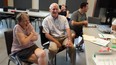 Raymond Dilling, centre, jokes around with clients at L'Arche Gathering Place in Lambeth. Philanthropist Arthur Labatt recently pledged to match donations dollar-for-dollar to push the $2.5 million campaign over the top. (DAN BROWN, The London Free Press)