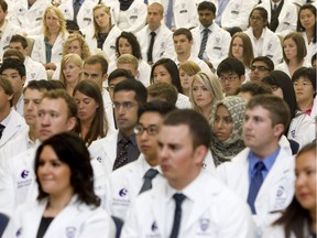 First year medical students at Western University's Schulich School of Medicine and Dentistry participate in the annual White Coat Ceremony on Wednesday, August 29, 2012.  (Free Press file photo)