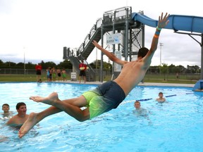 Carson Lumley aims for the perfect belly flop at Stronach pool. There are six outdoor pools in the city still open until the end of this week. Stronach will be open Sunday afternoon for the annual Pooch Plunge before closing for the season. (Mike Hensen/The London Free Press)