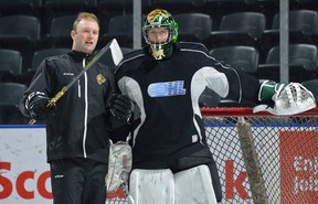 London Knights goaltender Joseph Raaymakers talks with goaltender scout Daren Machesney during practice in this file photo.