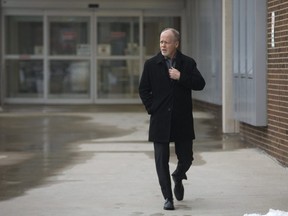 Suspended London police sergeant Dale Howe leaves London police headquarters. (Free Press file photo)