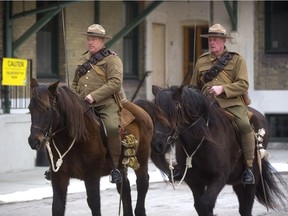 Steve Hartwick, left, and Andy Thompson -- riding two Canadian horses at Wolseley Barracks in March --  are two members of the 1st Hussars Calvary Troop who will participate in a remembrance ride in France this September, following the route the First Hussars took in 1918 at the end of The First World War. Mike Hensen/The London Free Press