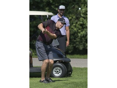 Nazem Kadri watches former London Knight Colin Martin during the Nazem Kadri Charity Golf Classic at Sunningdale Golf and Country Club in London on Thursday.  This year's tournament raised money for the Canadian Mental Health Association. 
(Derek Ruttan/The London Free Press)