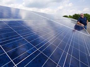 Dennis German, president of German Solar Corp., says there still a market for small solar arrays, like this one generating 300 kilowatts on a factory in the south end of the city despite the loss of government support. (Mike Hensen/The London Free Press)